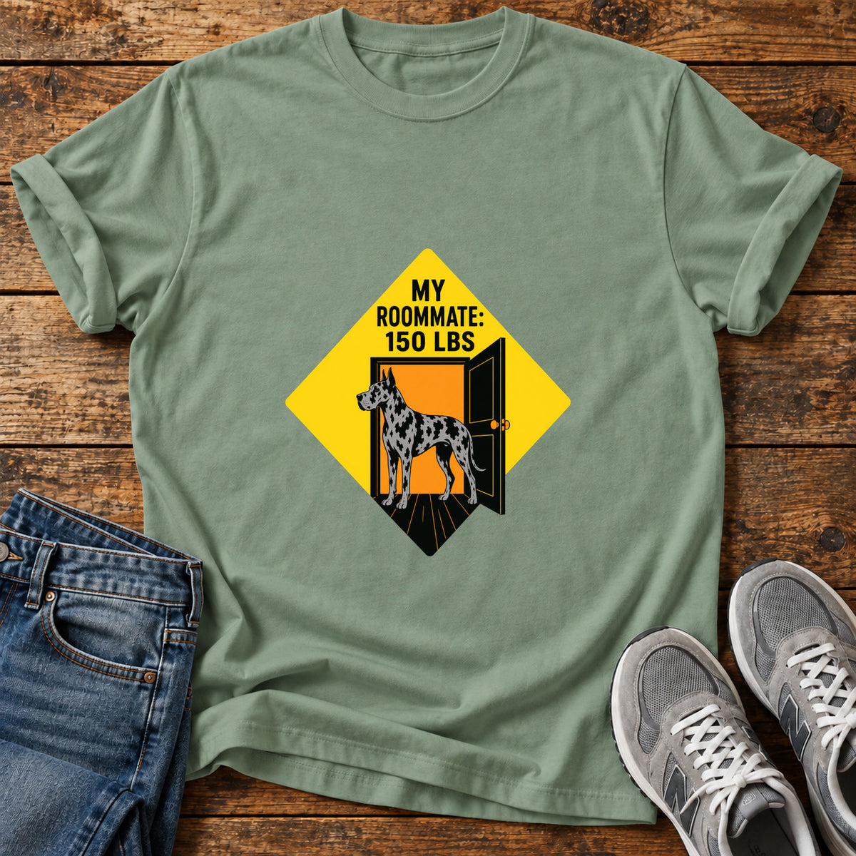 Roommate Dog Great Dane graphic T-shirt in Sage, shown on a flat-lay shirt mockup