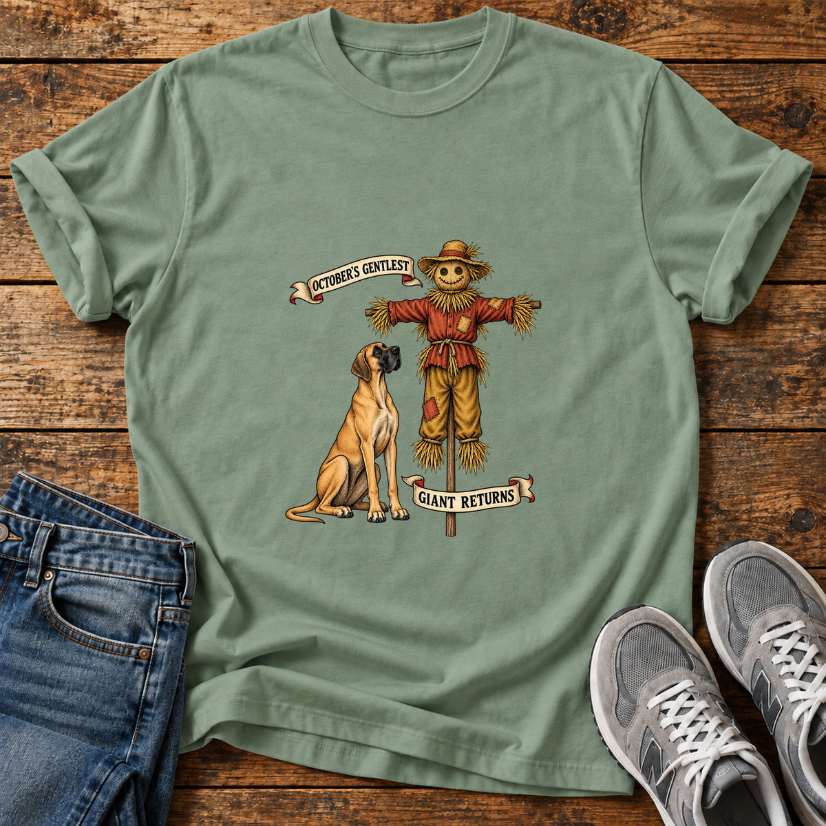 October's Gentlest Great Dane graphic T-shirt in Sage, shown on a flat-lay shirt mockup