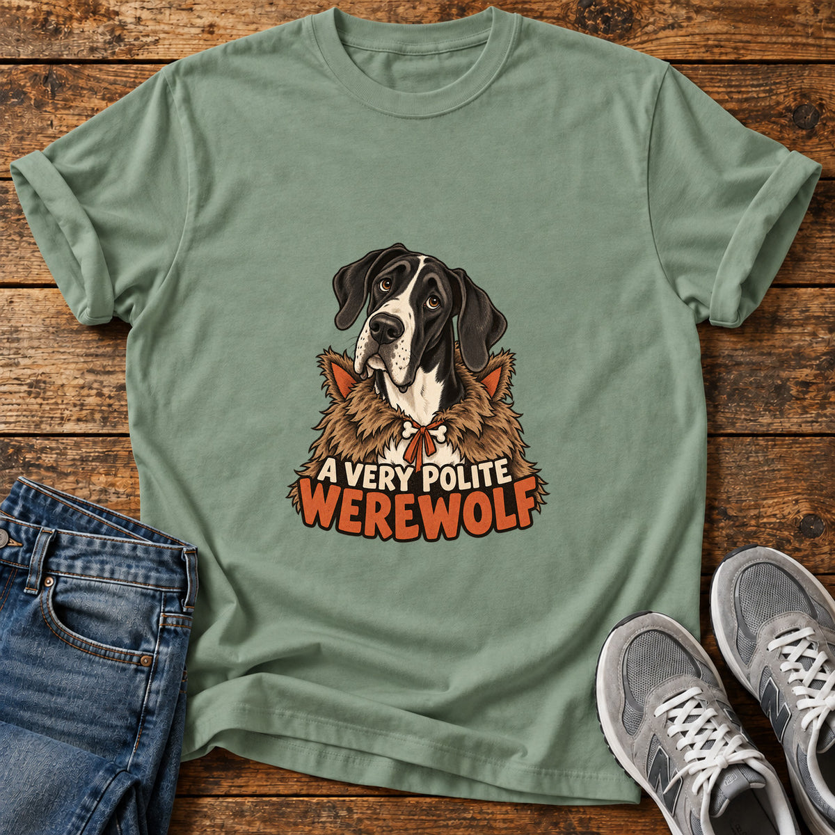 Polite Werewolf Great Dane graphic T-shirt in Sage, shown on a flat-lay shirt mockup