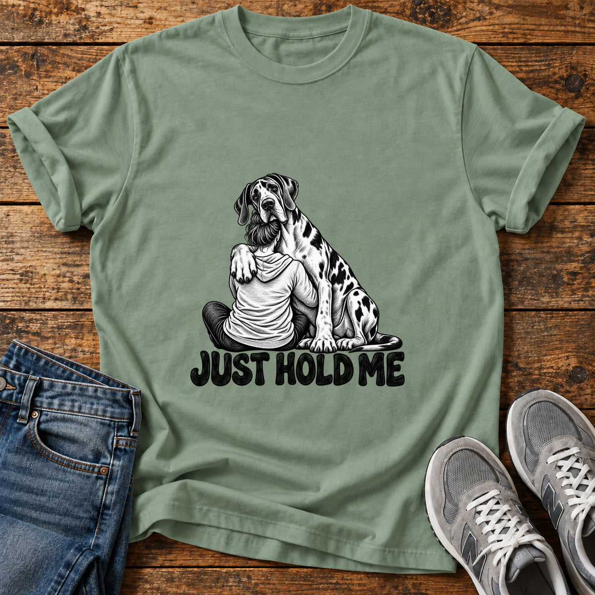 Just Hold Me Great Dane graphic T-shirt in Sage, shown on a flat-lay shirt mockup