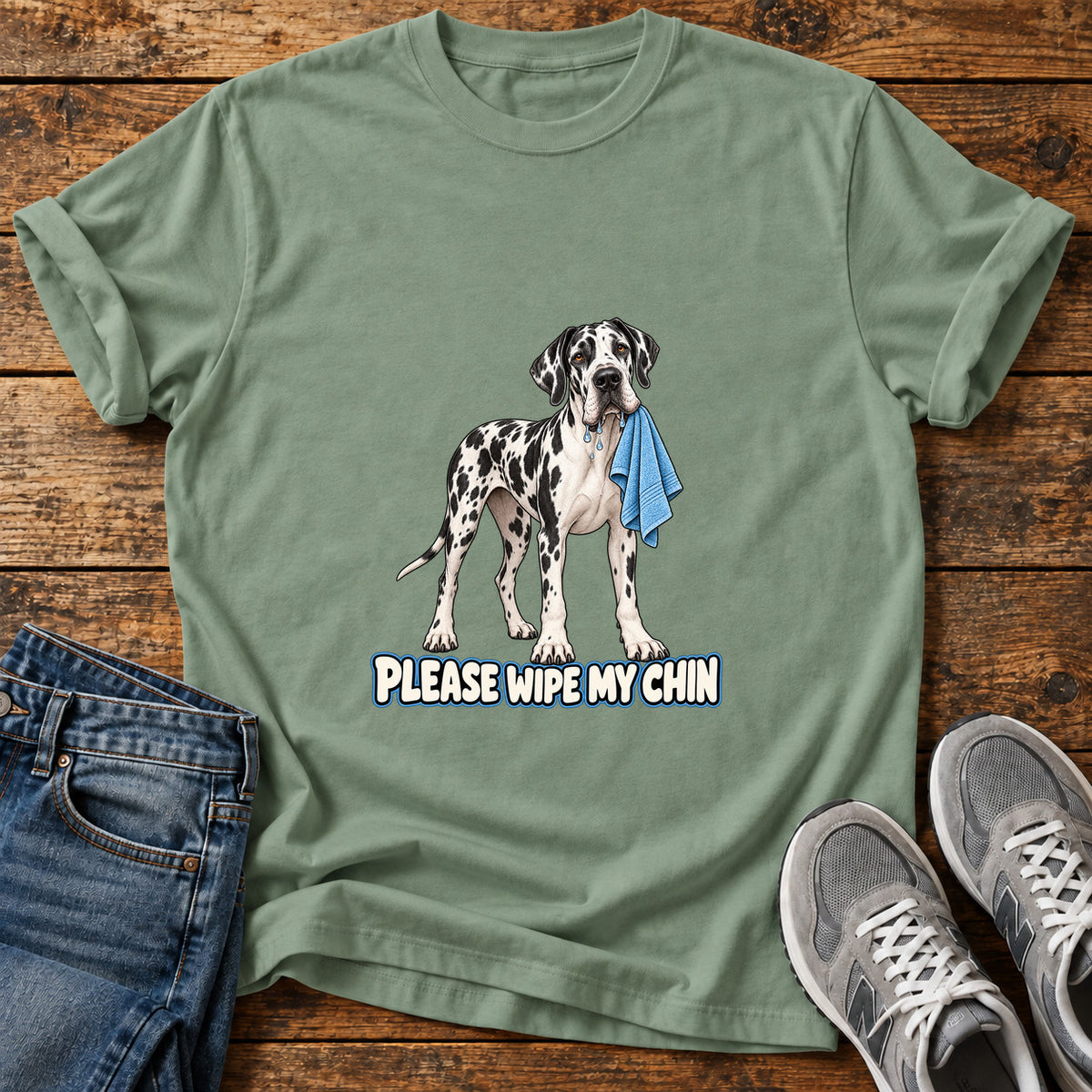Wipe My Chin Great Dane graphic T-shirt in Sage, shown on a flat-lay shirt mockup