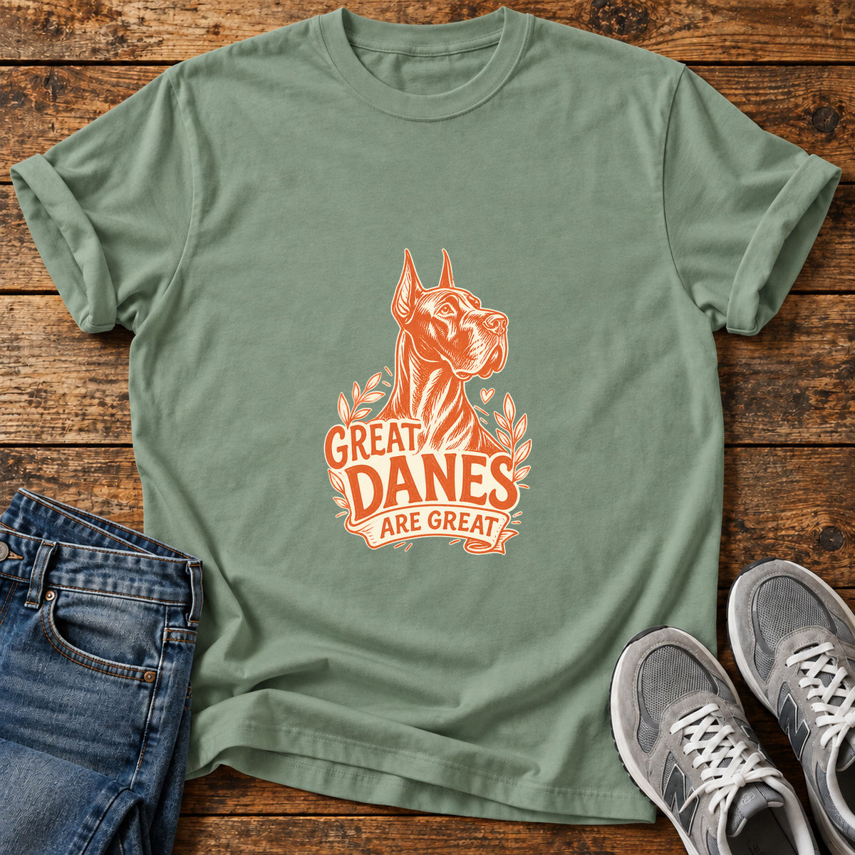 Great Danes Great graphic T-shirt in Sage, shown on a flat-lay shirt mockup