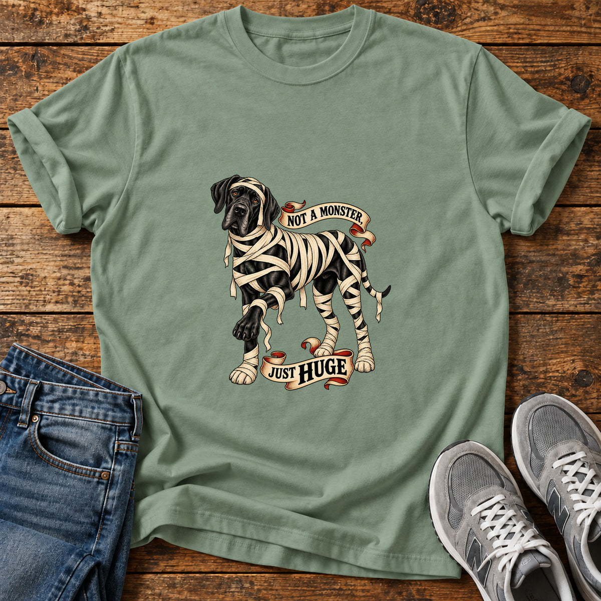Not A Monster Great Dane graphic T-shirt in Sage, shown on a flat-lay shirt mockup