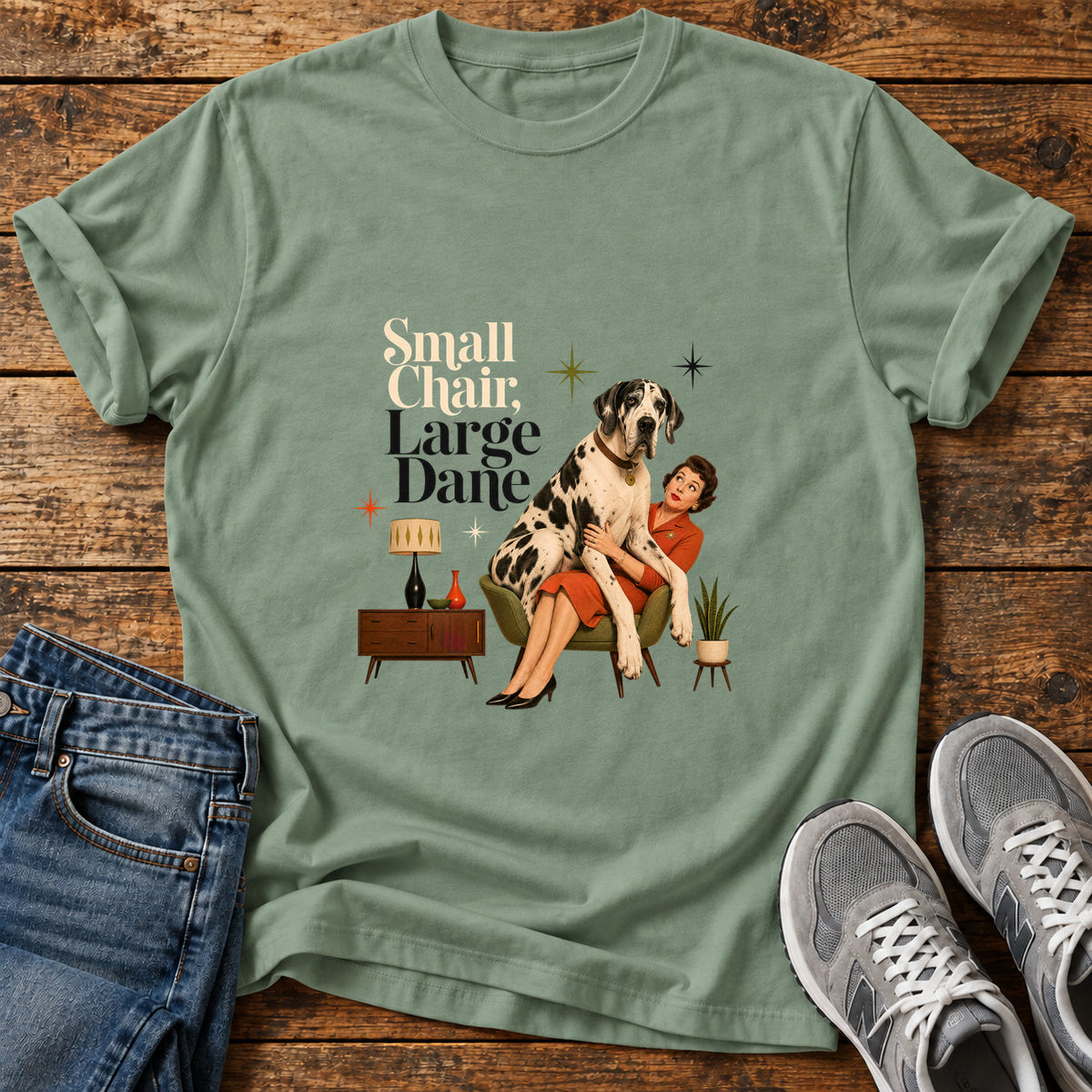 Small Chair Great Dane graphic T-shirt in Sage, shown on a flat-lay shirt mockup