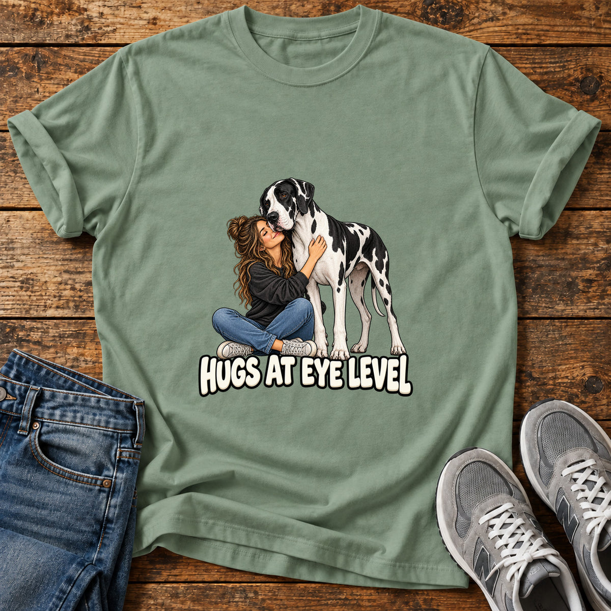 Hugs At Eye Great Dane graphic T-shirt in Sage, shown on a flat-lay shirt mockup