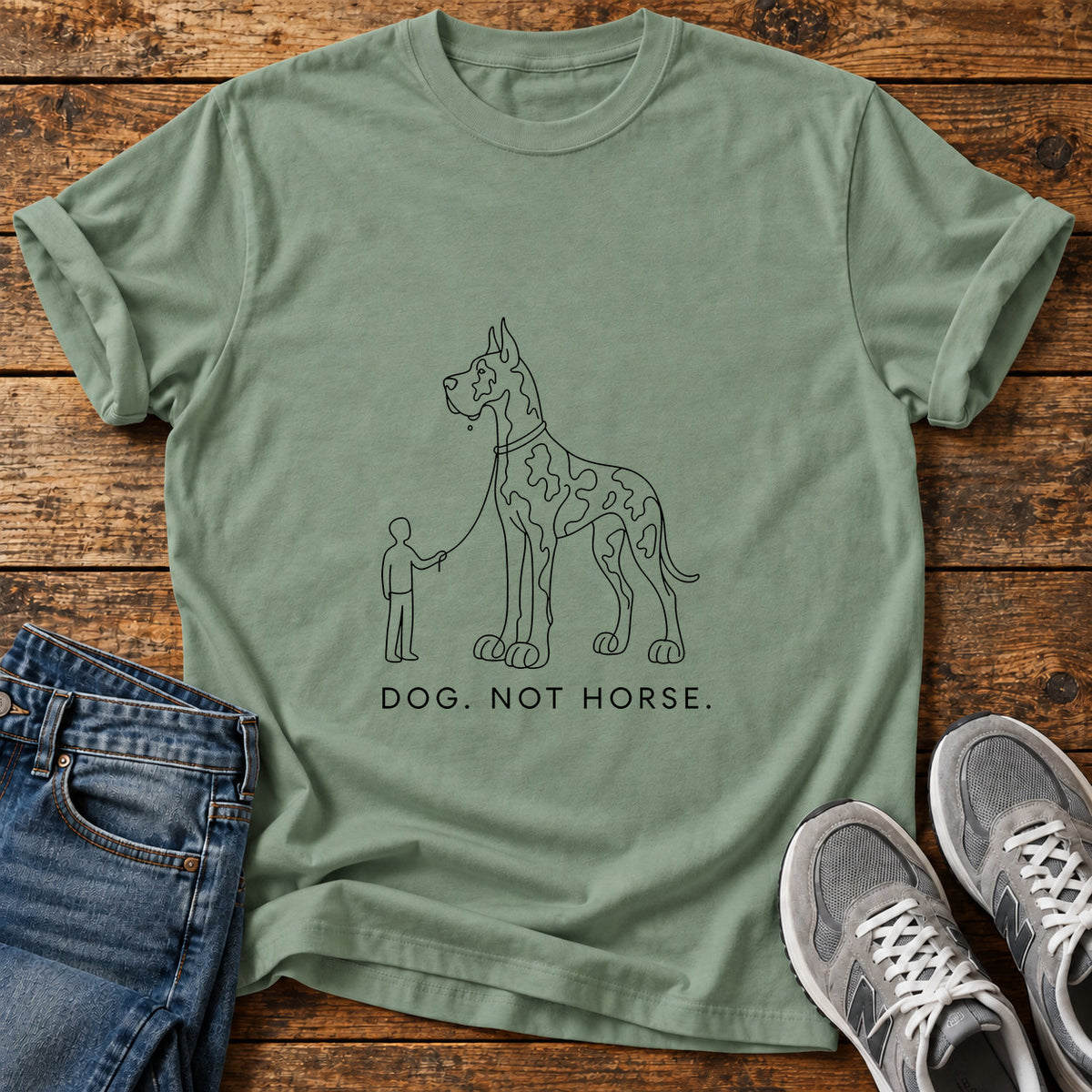 Dog Not Horse Great Dane graphic T-shirt in Sage, shown on a flat-lay shirt mockup