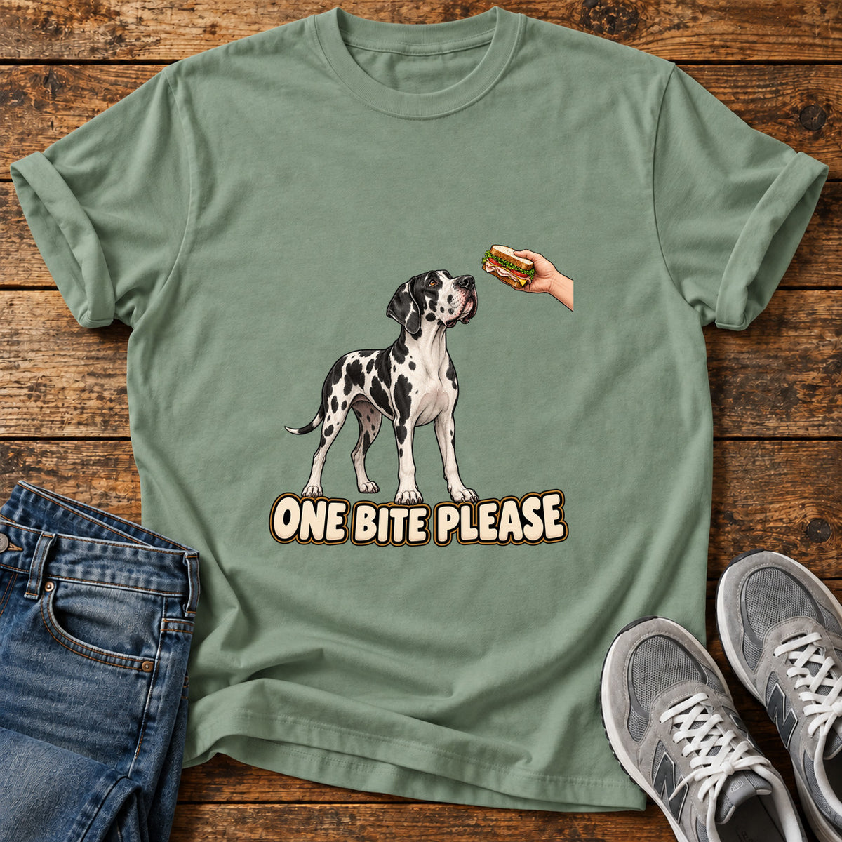 One Bite Please Great Dane graphic T-shirt in Sage, shown on a flat-lay shirt mockup