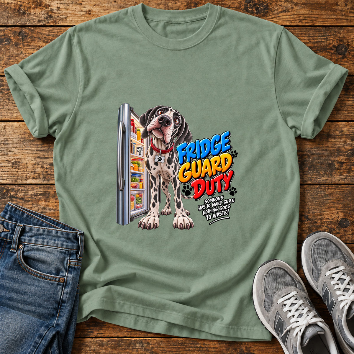 Fridge Guard Duty Great Dane graphic T-shirt in Sage, shown on a flat-lay shirt mockup