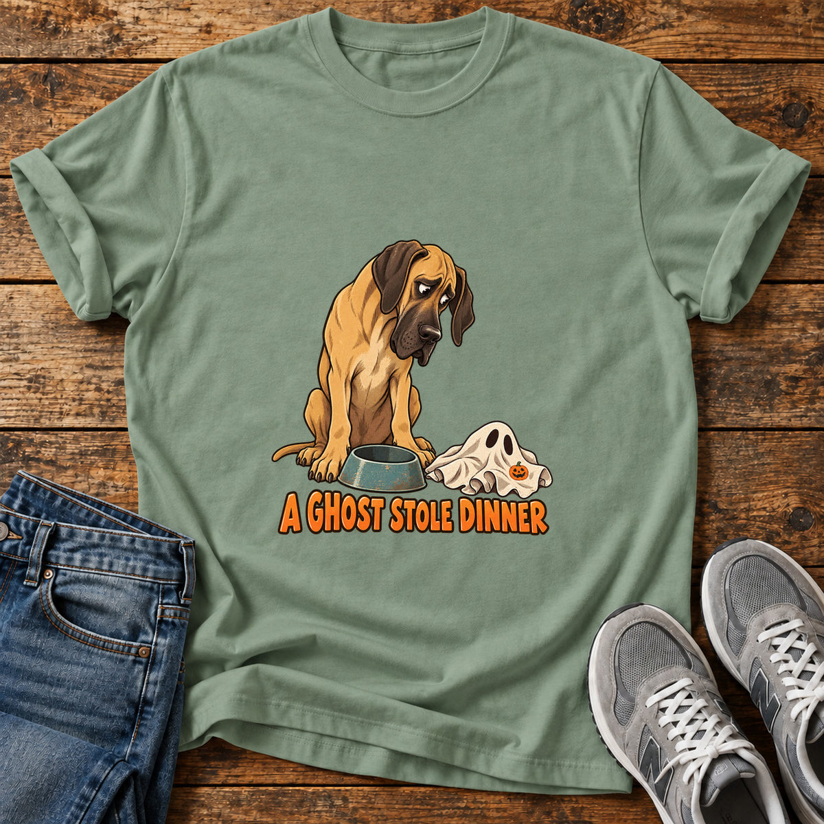 A Ghost Dinner Great Dane graphic T-shirt in Sage, shown on a flat-lay shirt mockup