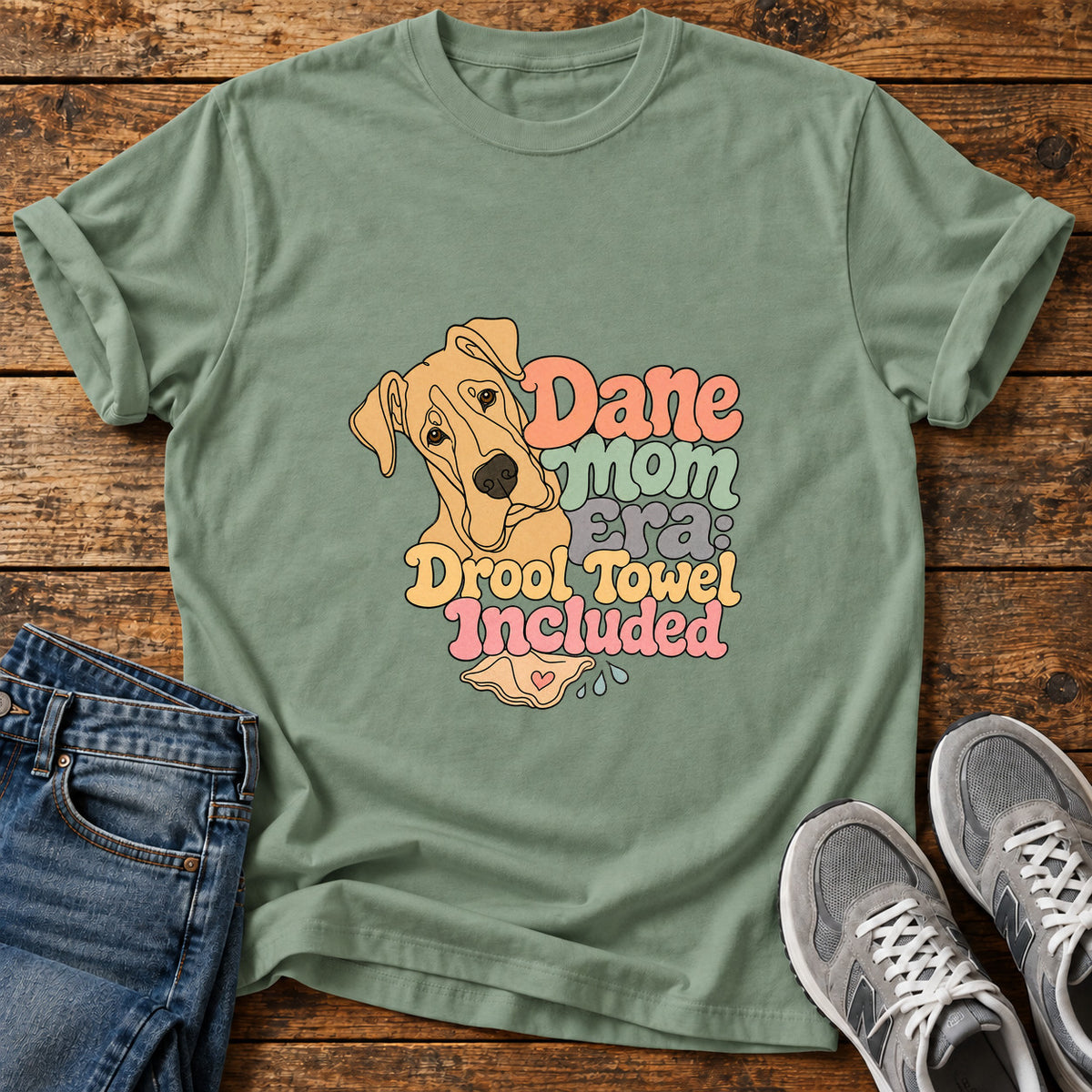 Dane Mom Era Great Dane graphic T-shirt in Sage, shown on a flat-lay shirt mockup