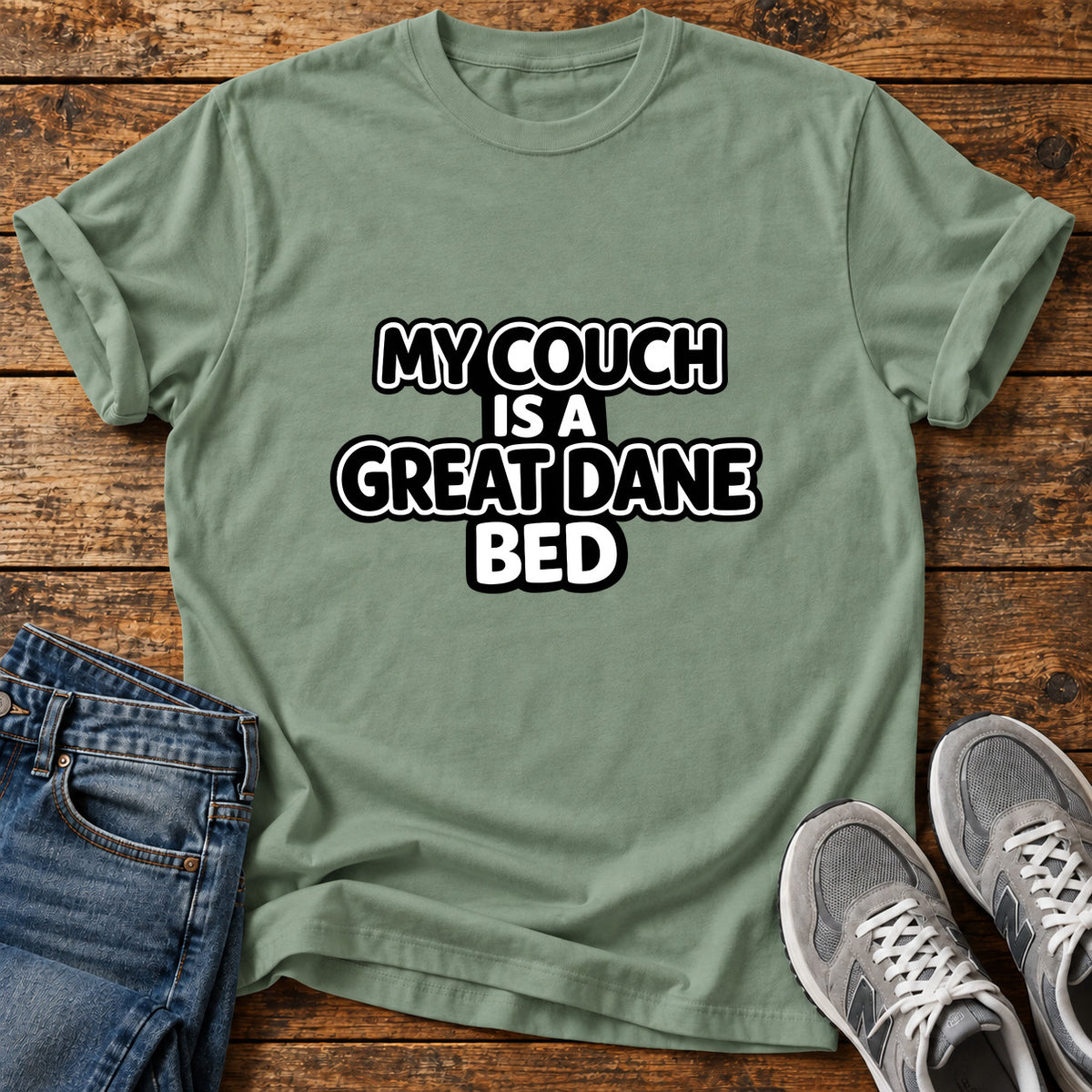 Great Dane Bed graphic T-shirt in Sage, shown on a flat-lay shirt mockup