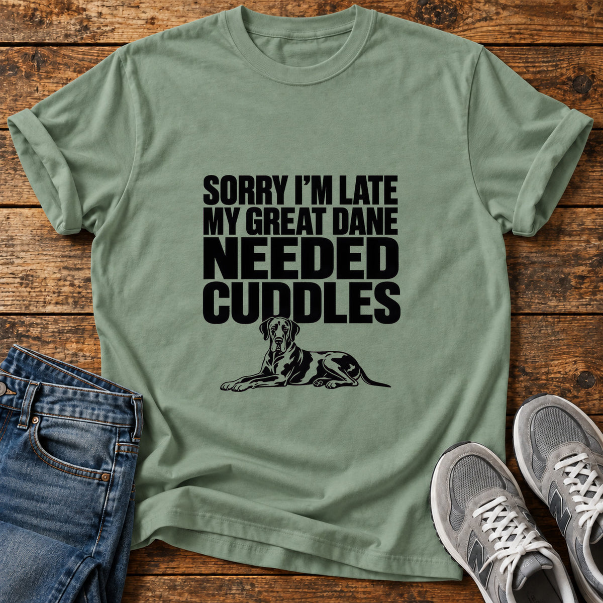 Great Dane Cuddles graphic T-shirt in Sage, shown on a flat-lay shirt mockup