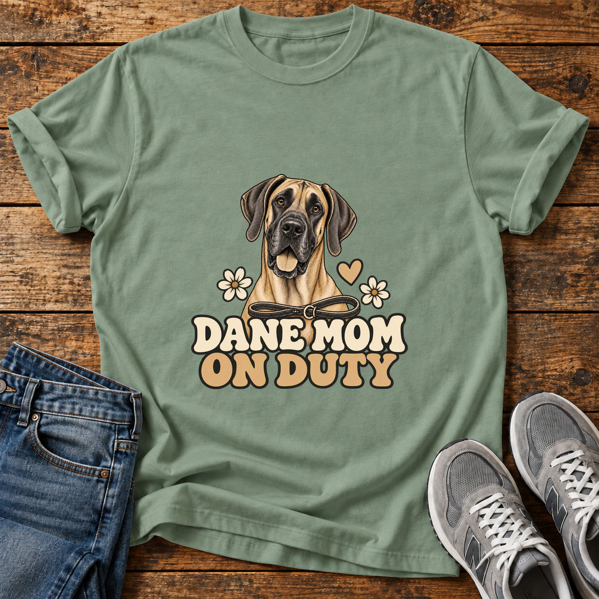 Dane Mom Duty Great Dane graphic T-shirt in Sage, shown on a flat-lay shirt mockup