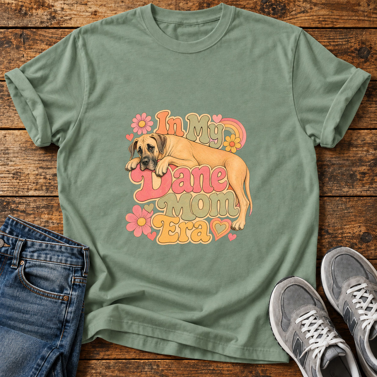 Dane Mom Era Great Dane graphic T-shirt in Sage, shown on a flat-lay shirt mockup