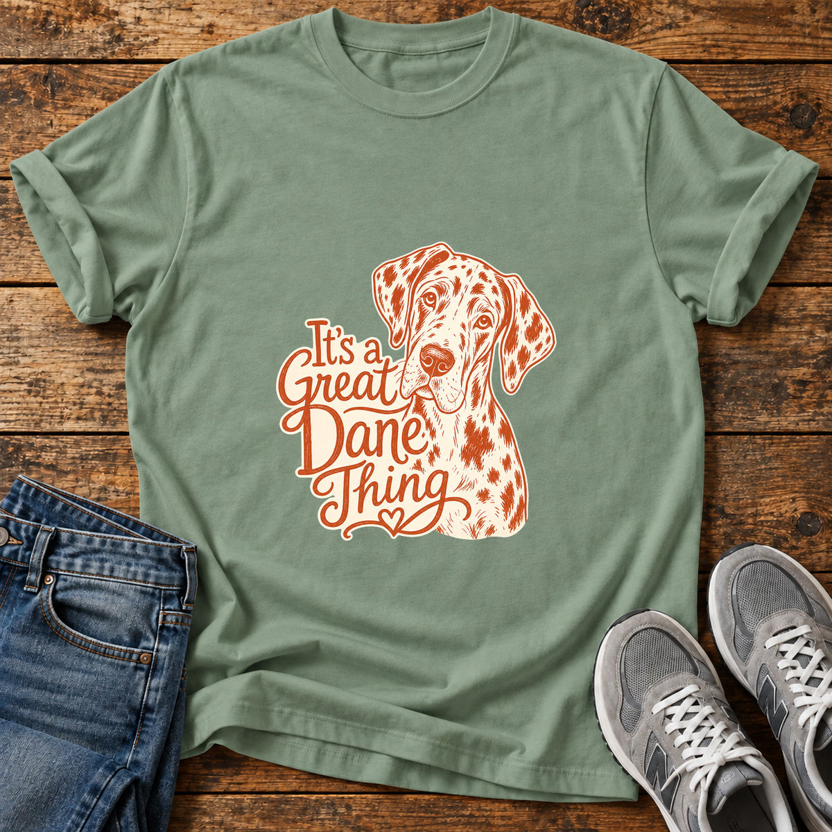 Great Dane Thing graphic T-shirt in Sage, shown on a flat-lay shirt mockup