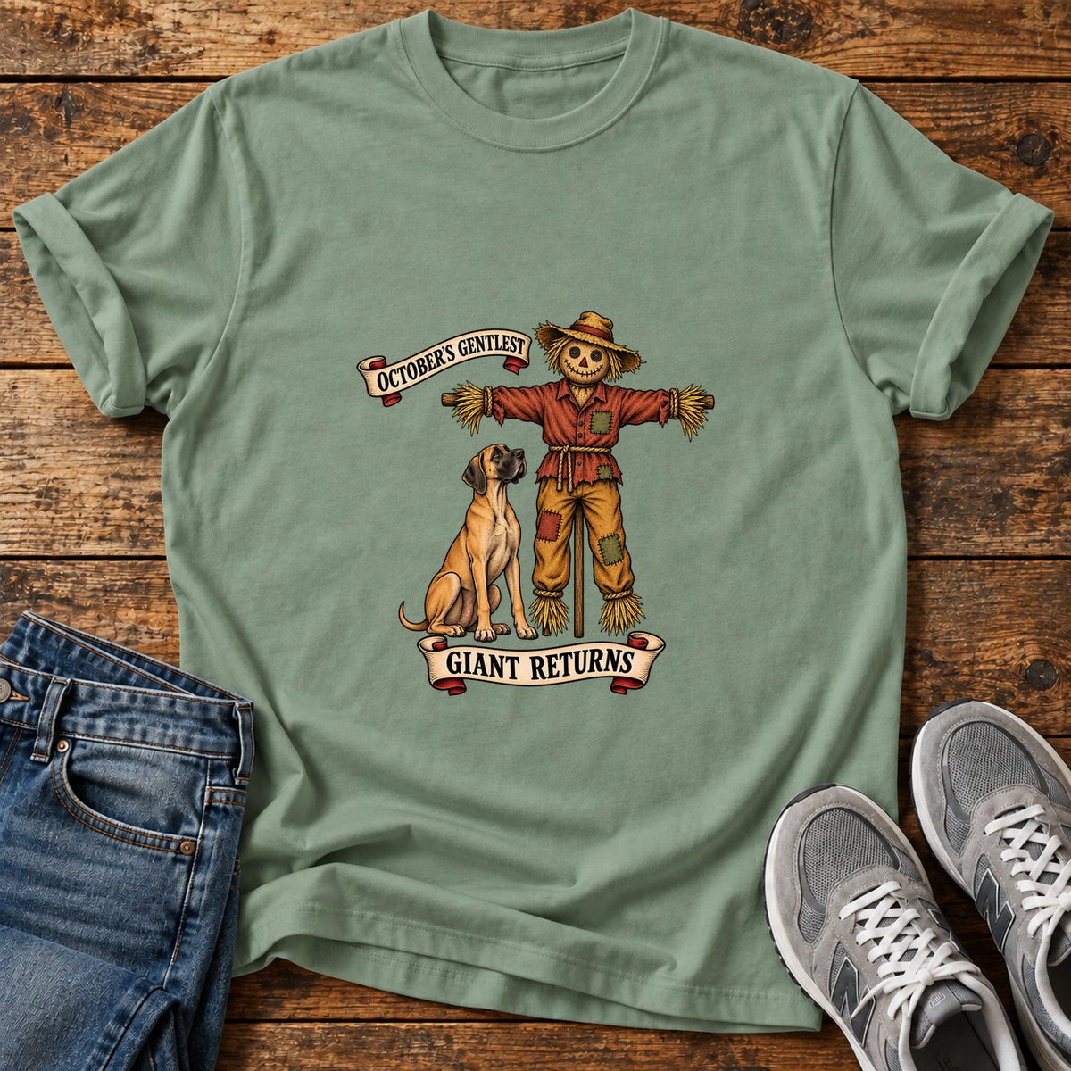 October's Gentlest Great Dane graphic T-shirt in Sage, shown on a flat-lay shirt mockup