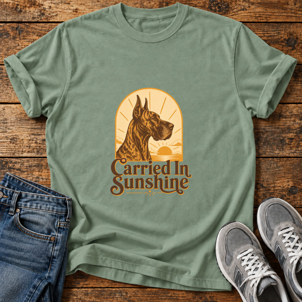 Carried In Sunshine Great Dane graphic T-shirt in Sage, shown on a flat-lay shirt mockup