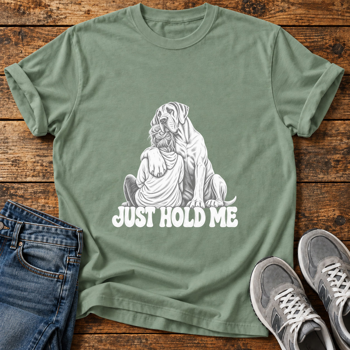 Just Hold Me Great Dane graphic T-shirt in Sage, shown on a flat-lay shirt mockup