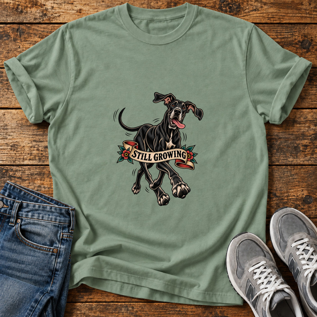 Still Growing Great Dane graphic T-shirt in Sage, shown on a flat-lay shirt mockup