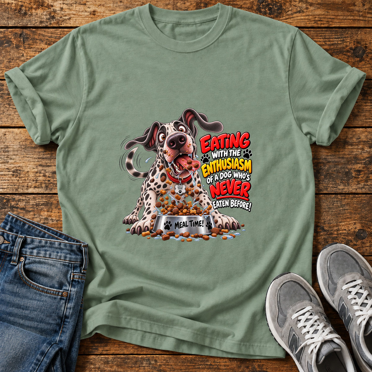 Eating Enthusiasm Great Dane graphic T-shirt in Sage, shown on a flat-lay shirt mockup