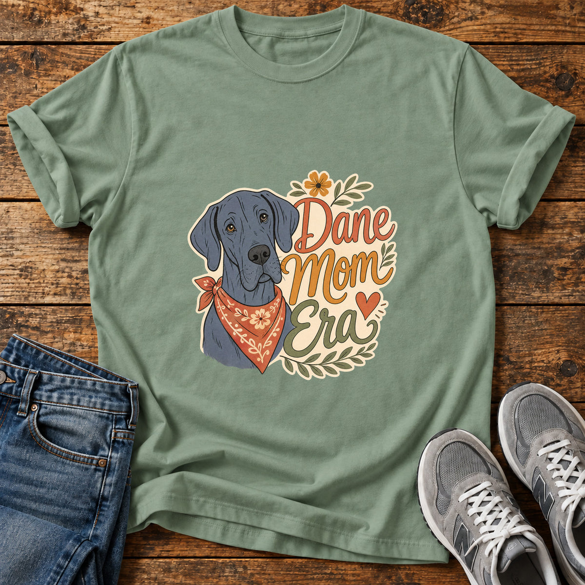 Dane Mom Era Great Dane graphic T-shirt in Sage, shown on a flat-lay shirt mockup