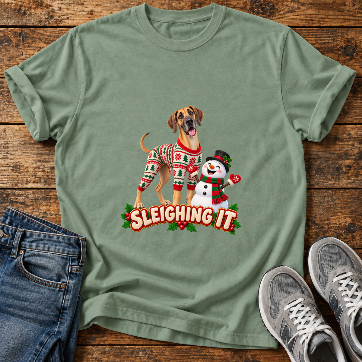 Sleighing It Great Dane graphic T-shirt in Sage, shown on a flat-lay shirt mockup