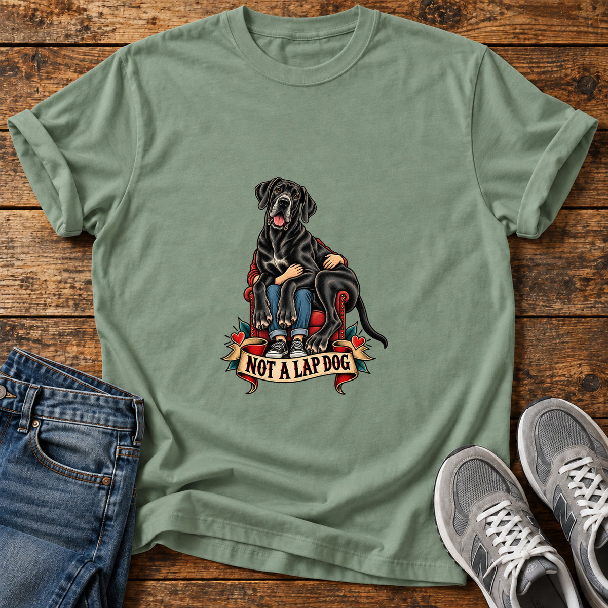 Not A Lapdog Great Dane graphic T-shirt in Sage, shown on a flat-lay shirt mockup