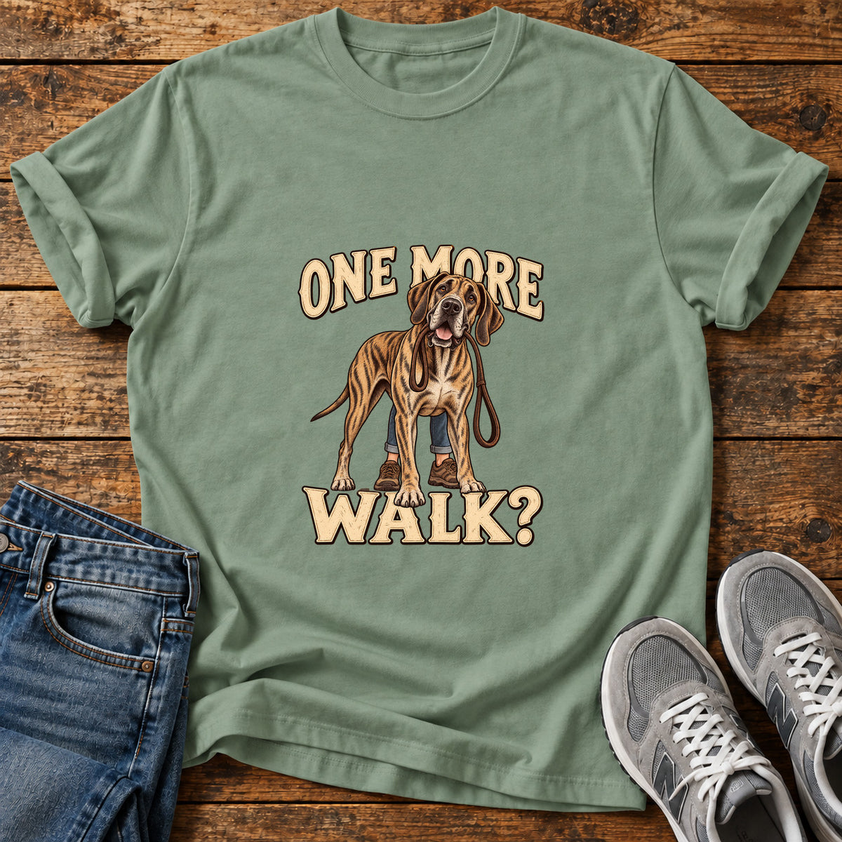 One More Walk Great Dane graphic T-shirt in Sage, shown on a flat-lay shirt mockup