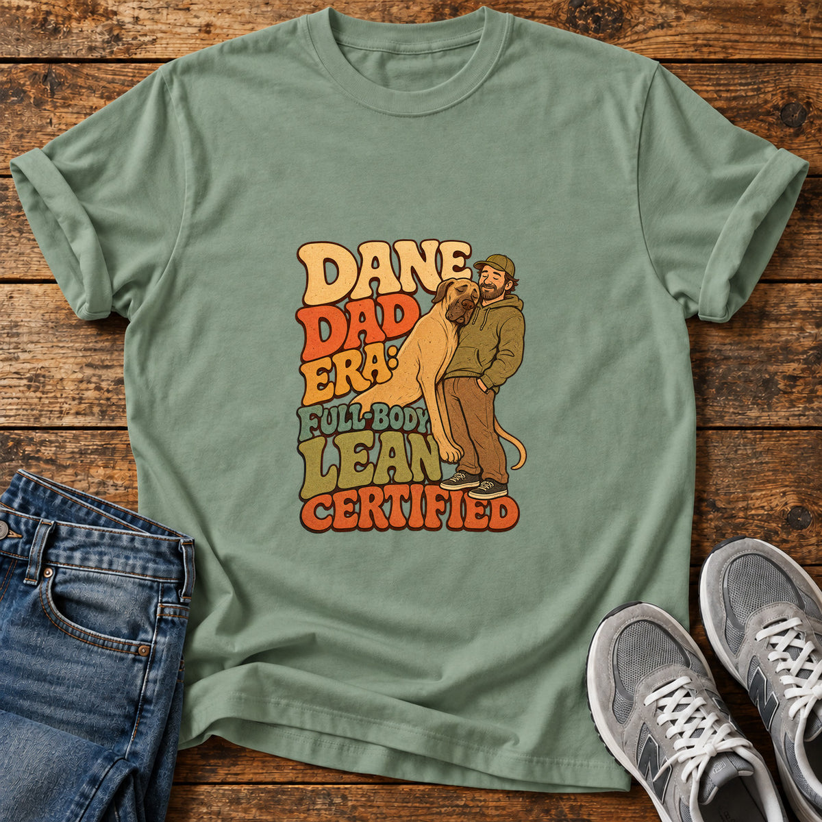 Dane Dad Certified Great Dane graphic T-shirt in Sage, shown on a flat-lay shirt mockup