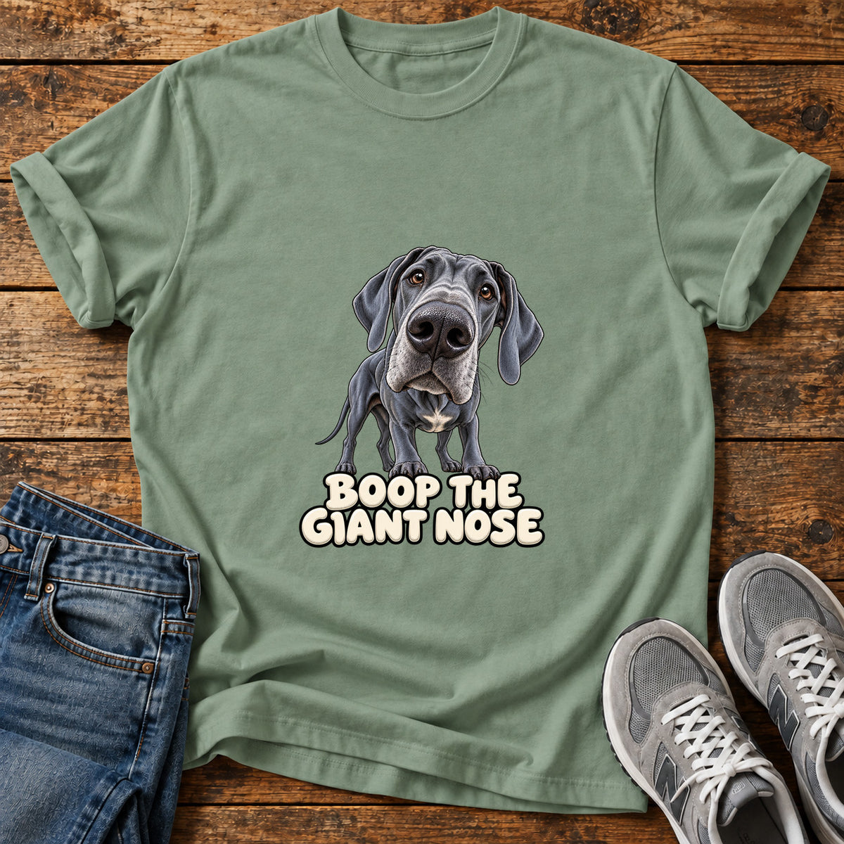 Boop Giant Nose Great Dane graphic T-shirt in Sage, shown on a flat-lay shirt mockup