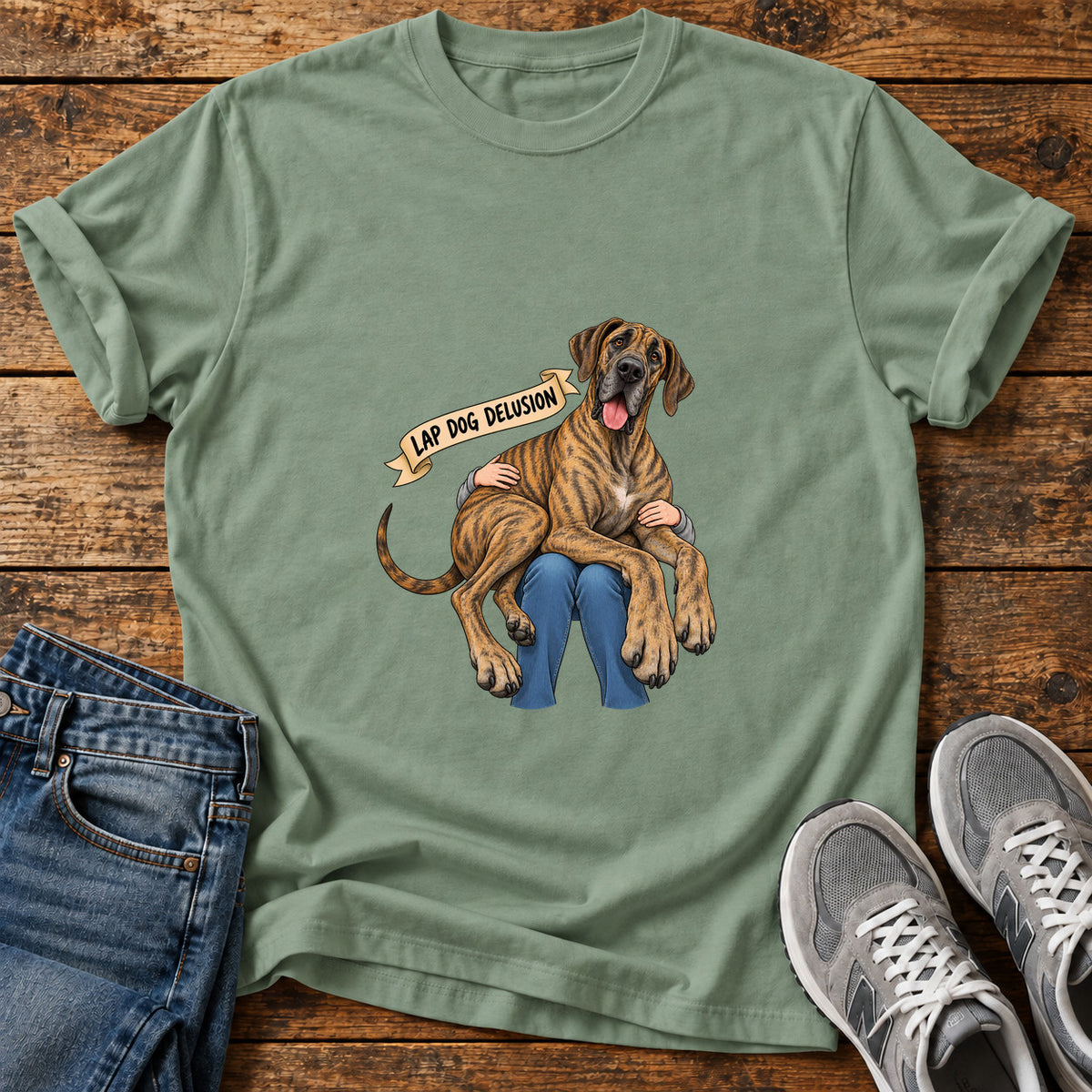 Lap Dog Delusion Great Dane graphic T-shirt in Sage, shown on a flat-lay shirt mockup