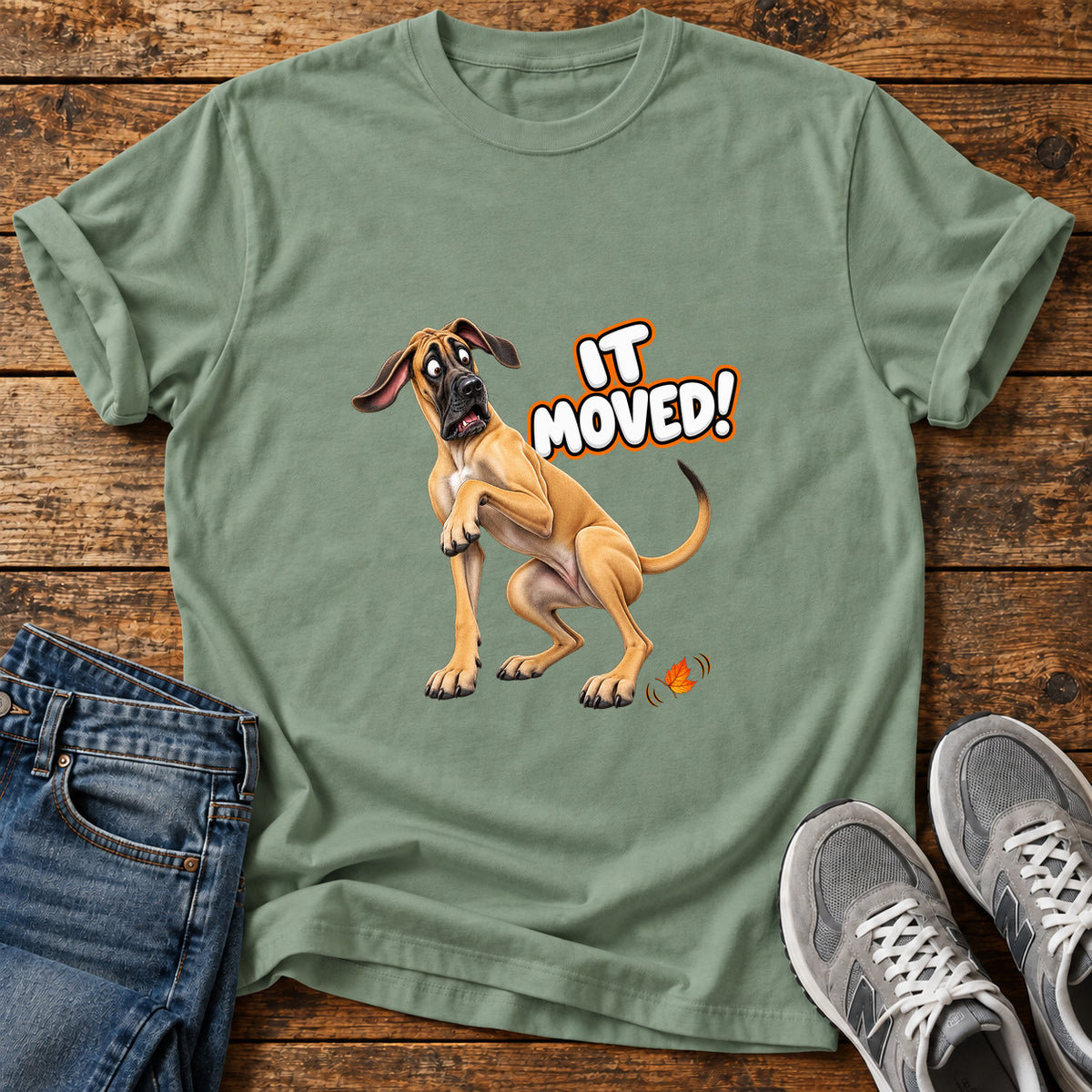 It Moved Great Dane graphic T-shirt in Sage, shown on a flat-lay shirt mockup