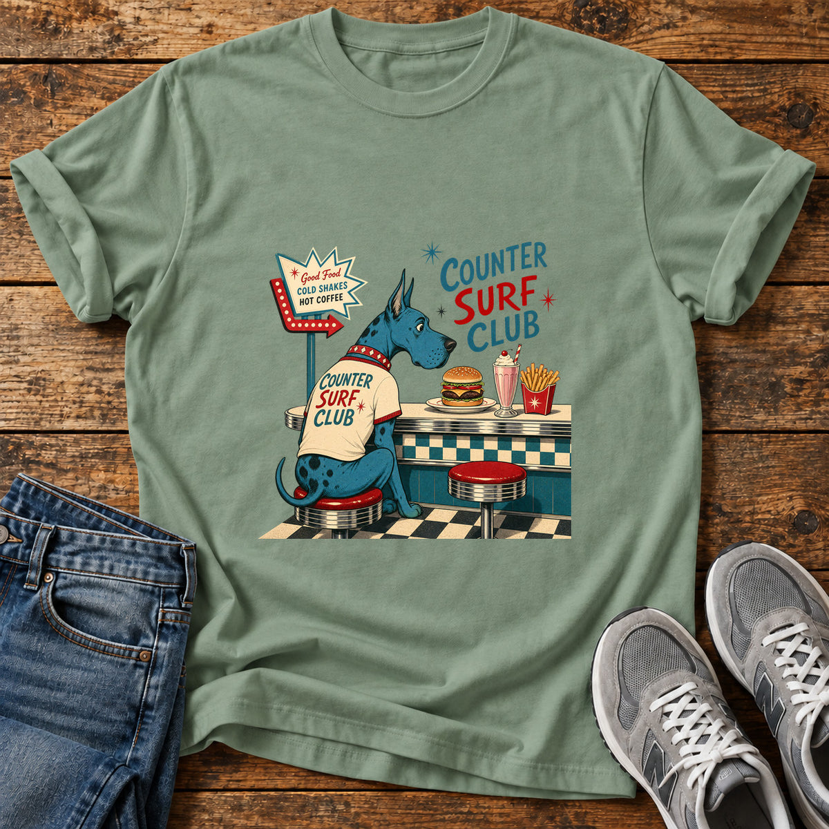 Counter Surf Club Great Dane graphic T-shirt in Sage, shown on a flat-lay shirt mockup