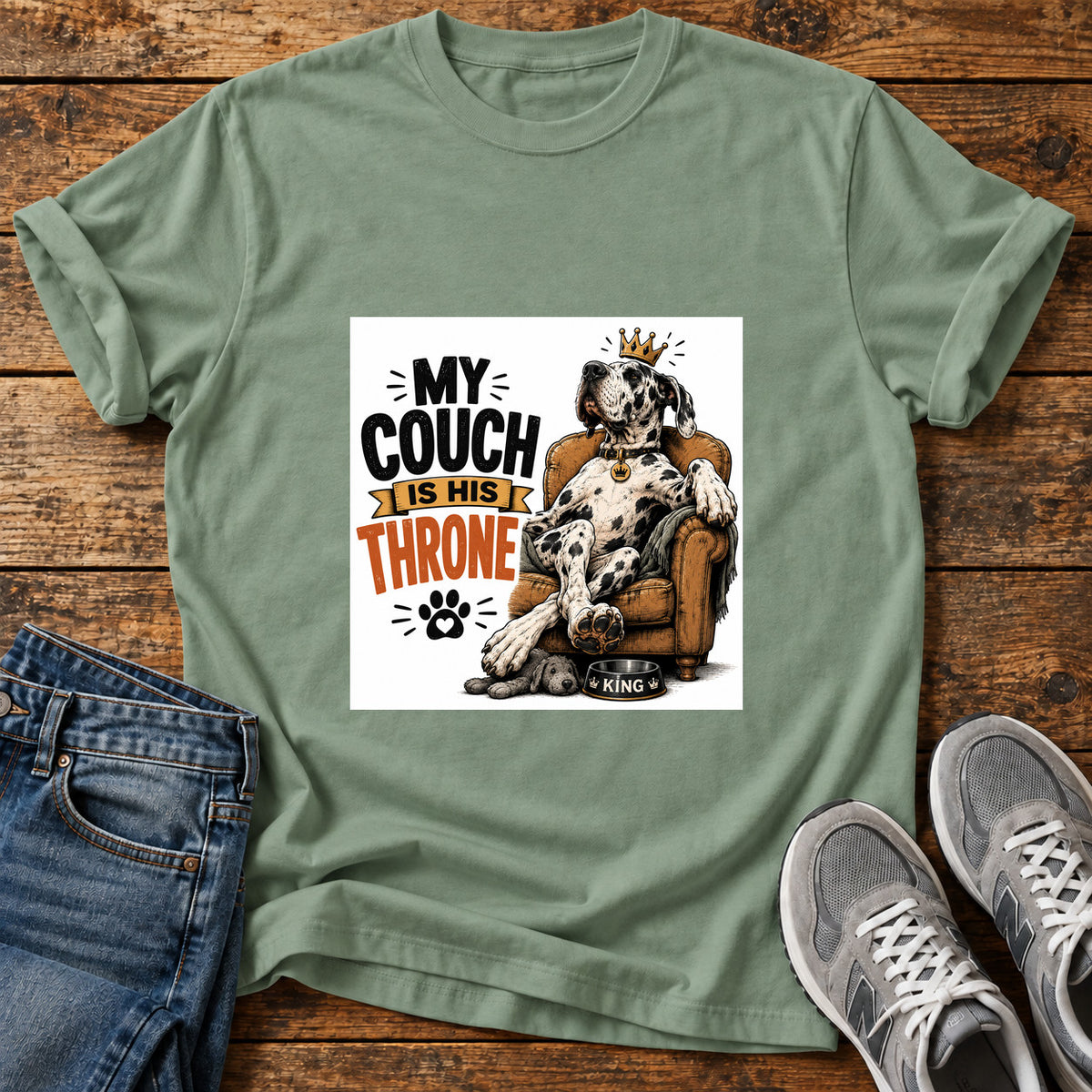Couch Throne Great Dane graphic T-shirt in Sage, shown on a flat-lay shirt mockup
