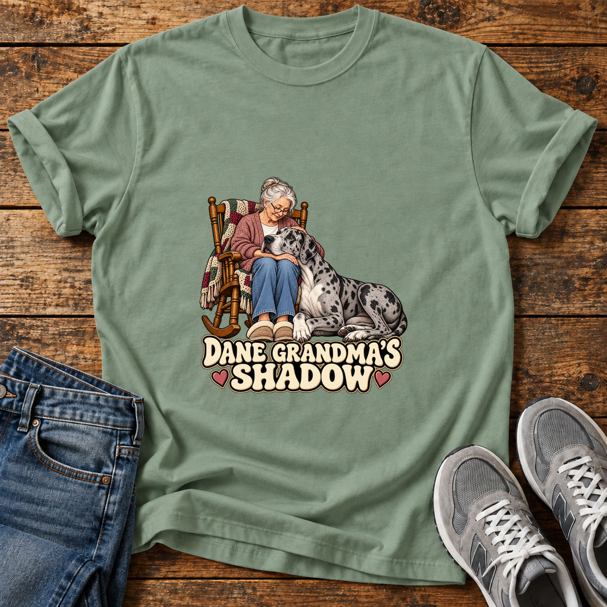 Dane Grandma's Shadow Great Dane graphic T-shirt in Sage, shown on a flat-lay shirt mockup