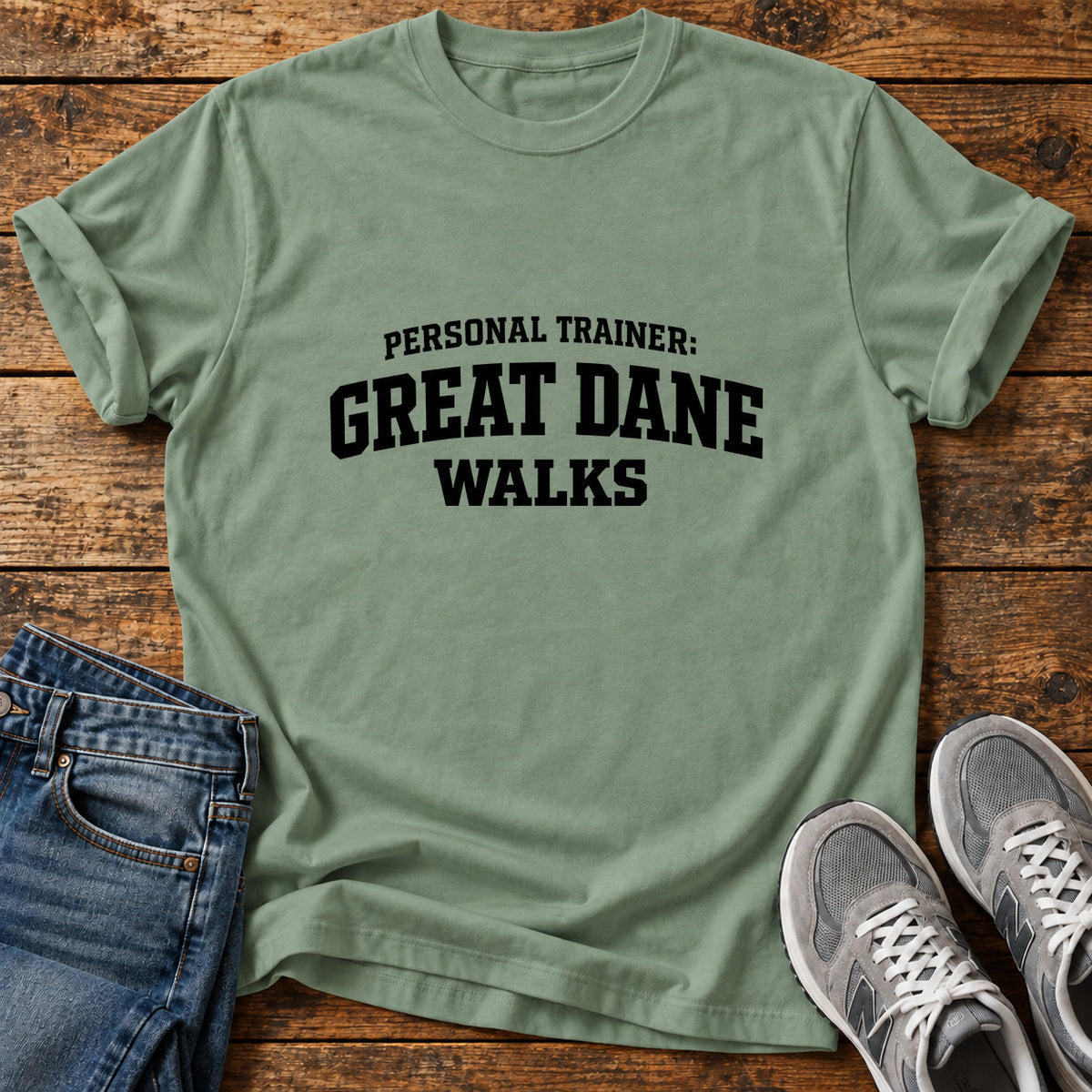 Great Dane Trainer graphic T-shirt in Sage, shown on a flat-lay shirt mockup