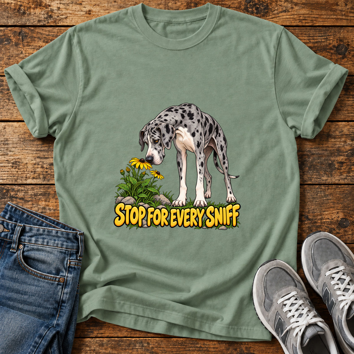 Stop Sniffing Time Great Dane graphic T-shirt in Sage, shown on a flat-lay shirt mockup