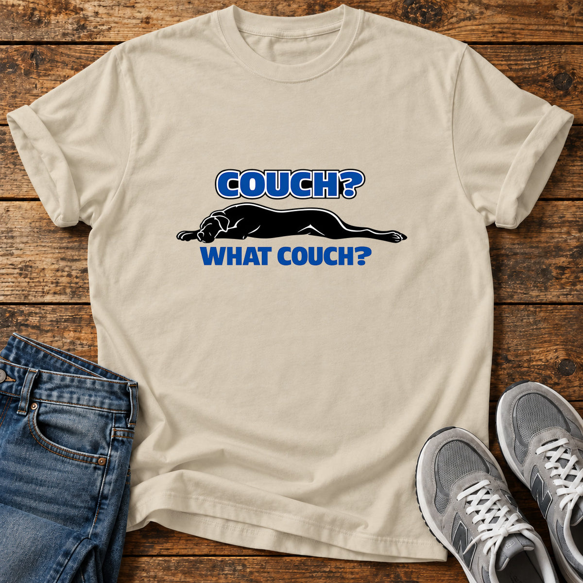 Couch What Couch Great Dane graphic T-shirt in Sand, shown on a flat-lay shirt mockup