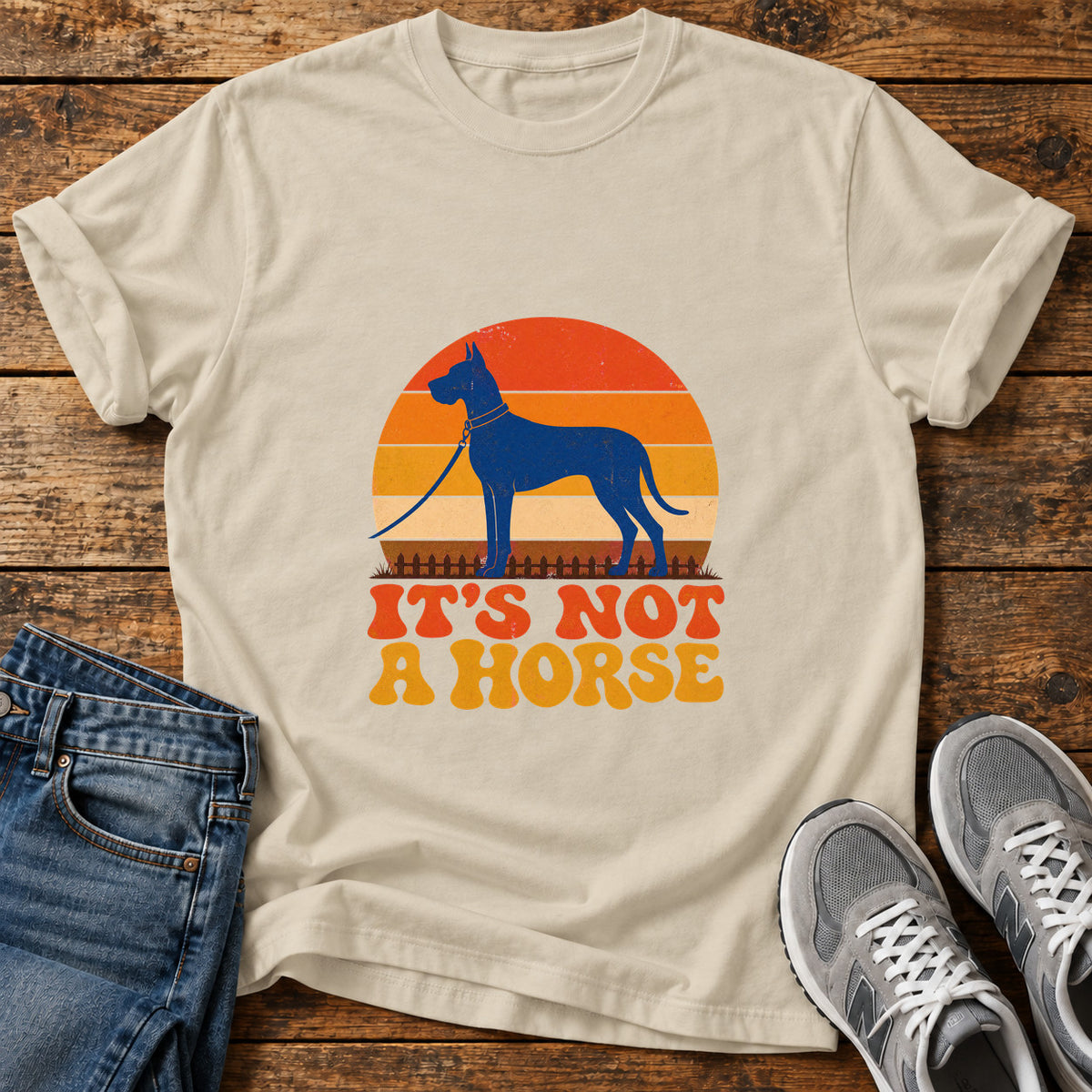 It's Not Horse Great Dane graphic T-shirt in Sand, shown on a flat-lay shirt mockup