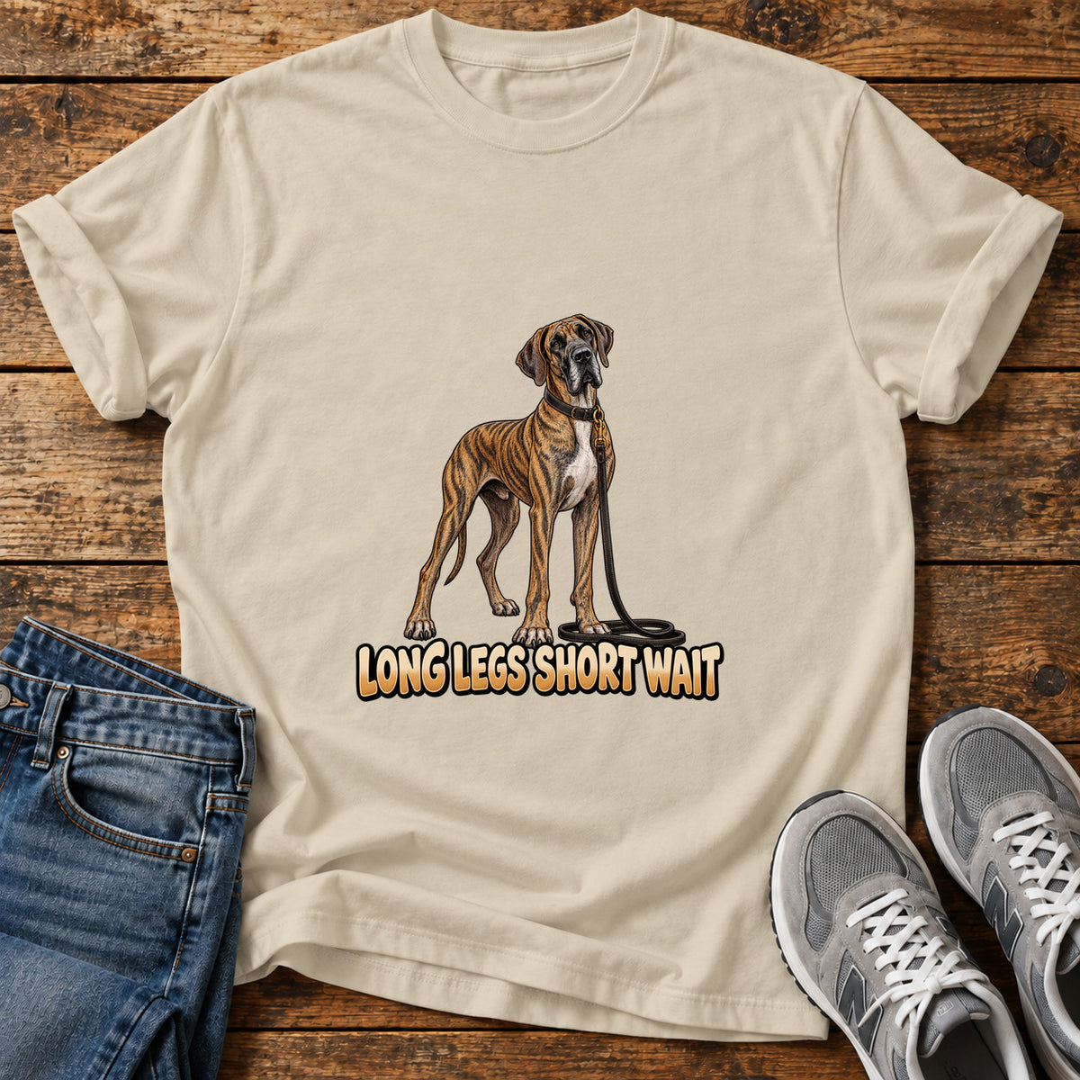 Long Legs Great Dane graphic T-shirt in Sand, shown on a flat-lay shirt mockup