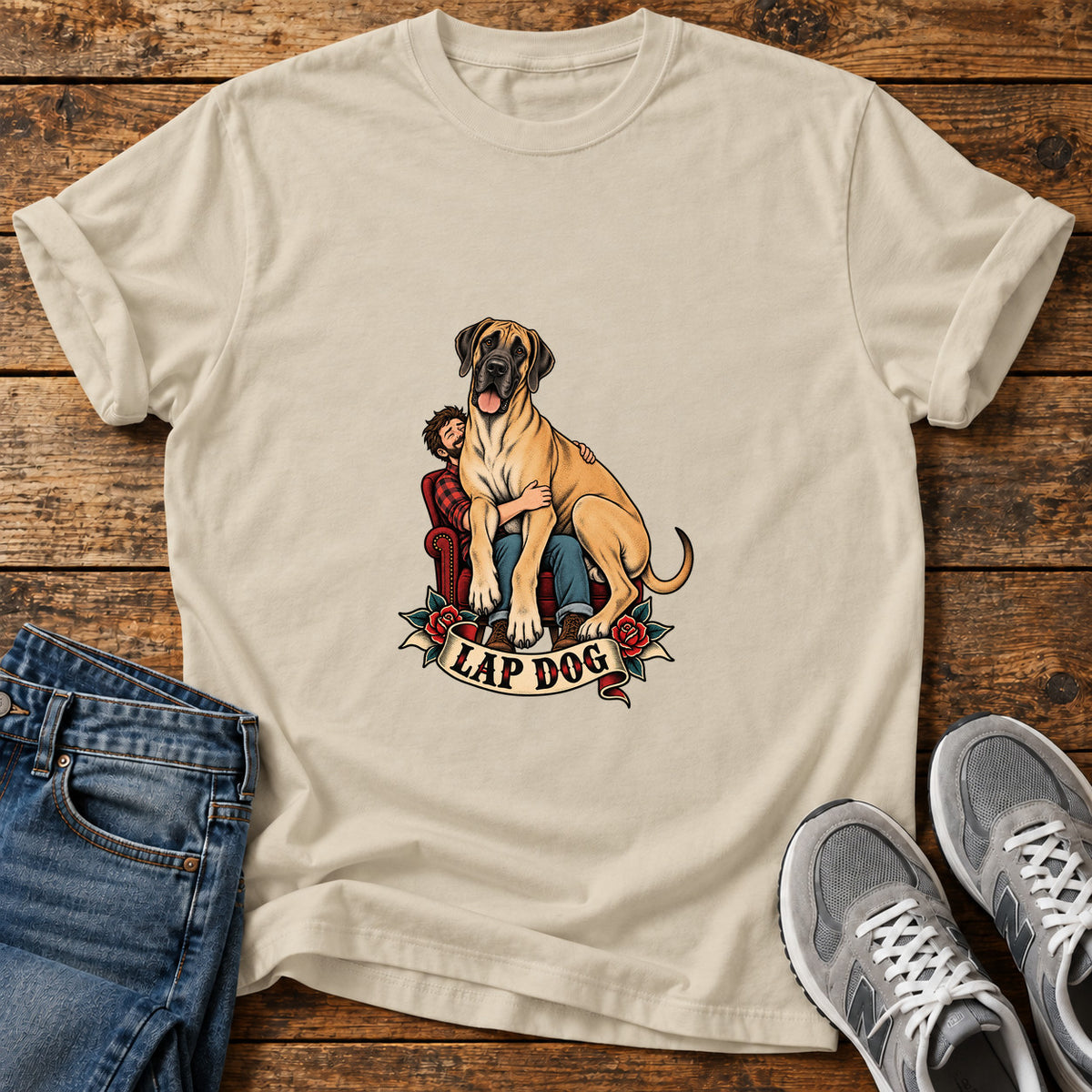 Lap Dog Great Dane graphic T-shirt in Sand, shown on a flat-lay shirt mockup