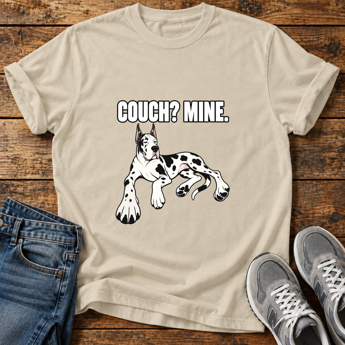 Couch Mine Great Dane graphic T-shirt in Sand, shown on a flat-lay shirt mockup