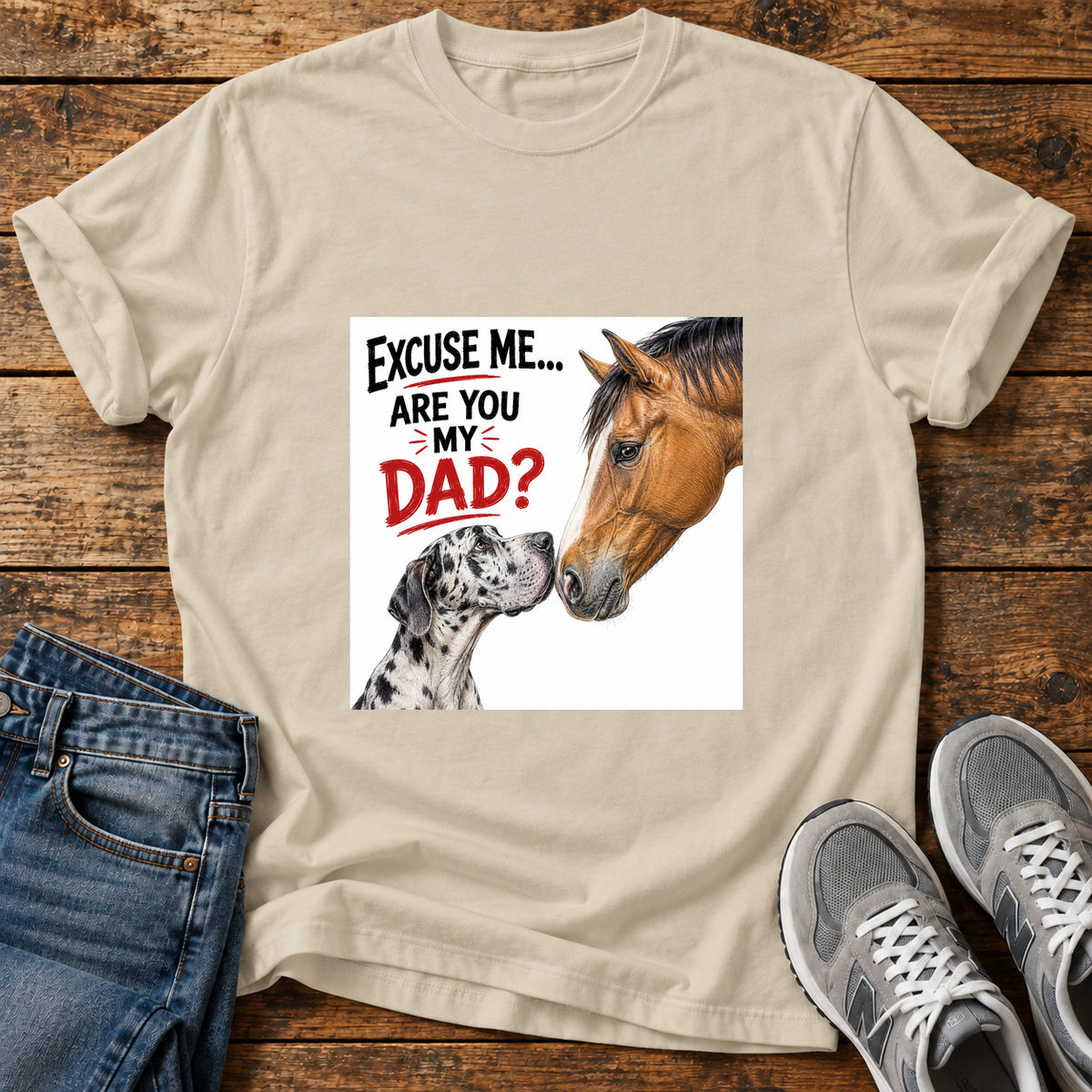 Are You Dad Great Dane graphic T-shirt in Sand, shown on a flat-lay shirt mockup