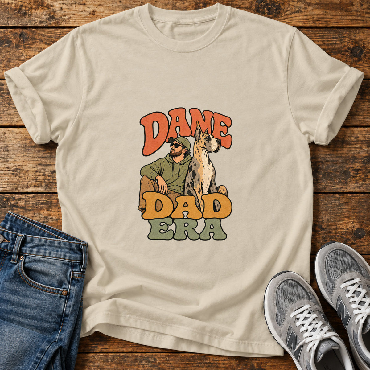 Dane Dad Era Great Dane graphic T-shirt in Sand, shown on a flat-lay shirt mockup