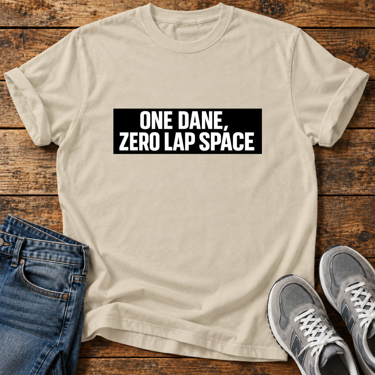One Dane Zero Great Dane graphic T-shirt in Sand, shown on a flat-lay shirt mockup