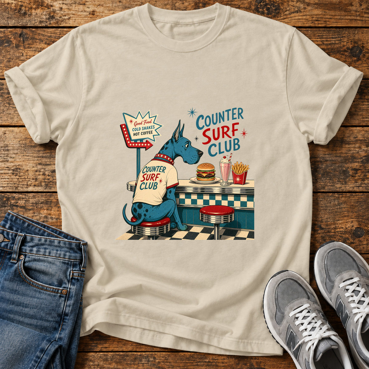 Counter Surf Club Great Dane graphic T-shirt in Sand, shown on a flat-lay shirt mockup