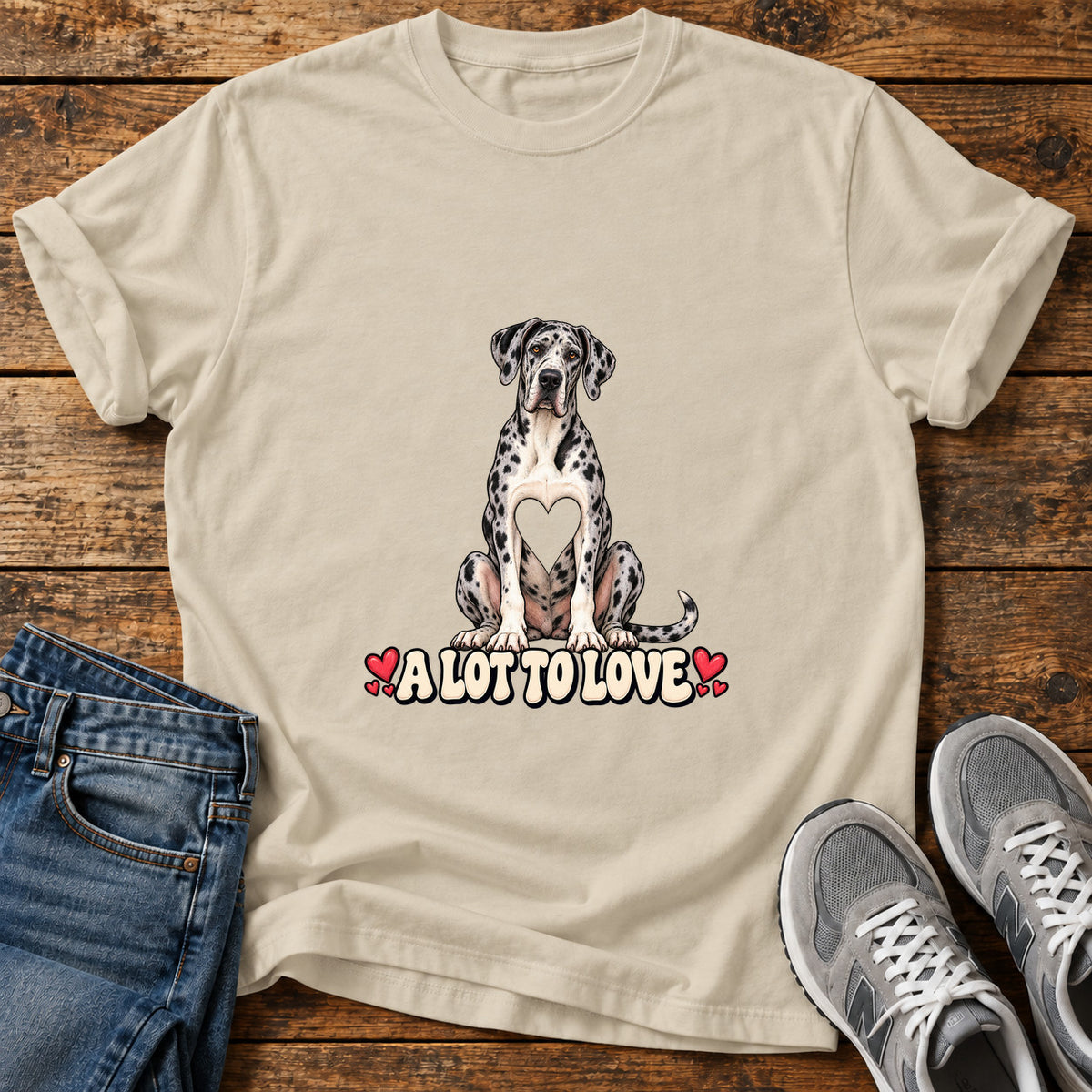 A Lot To Great Dane graphic T-shirt in Sand, shown on a flat-lay shirt mockup