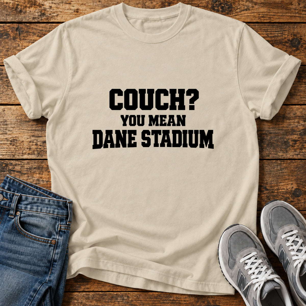 Couch Stadium Great Dane graphic T-shirt in Sand, shown on a flat-lay shirt mockup