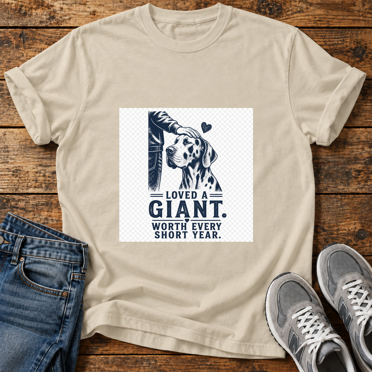 Loved A Giant Great Dane graphic T-shirt in Sand, shown on a flat-lay shirt mockup