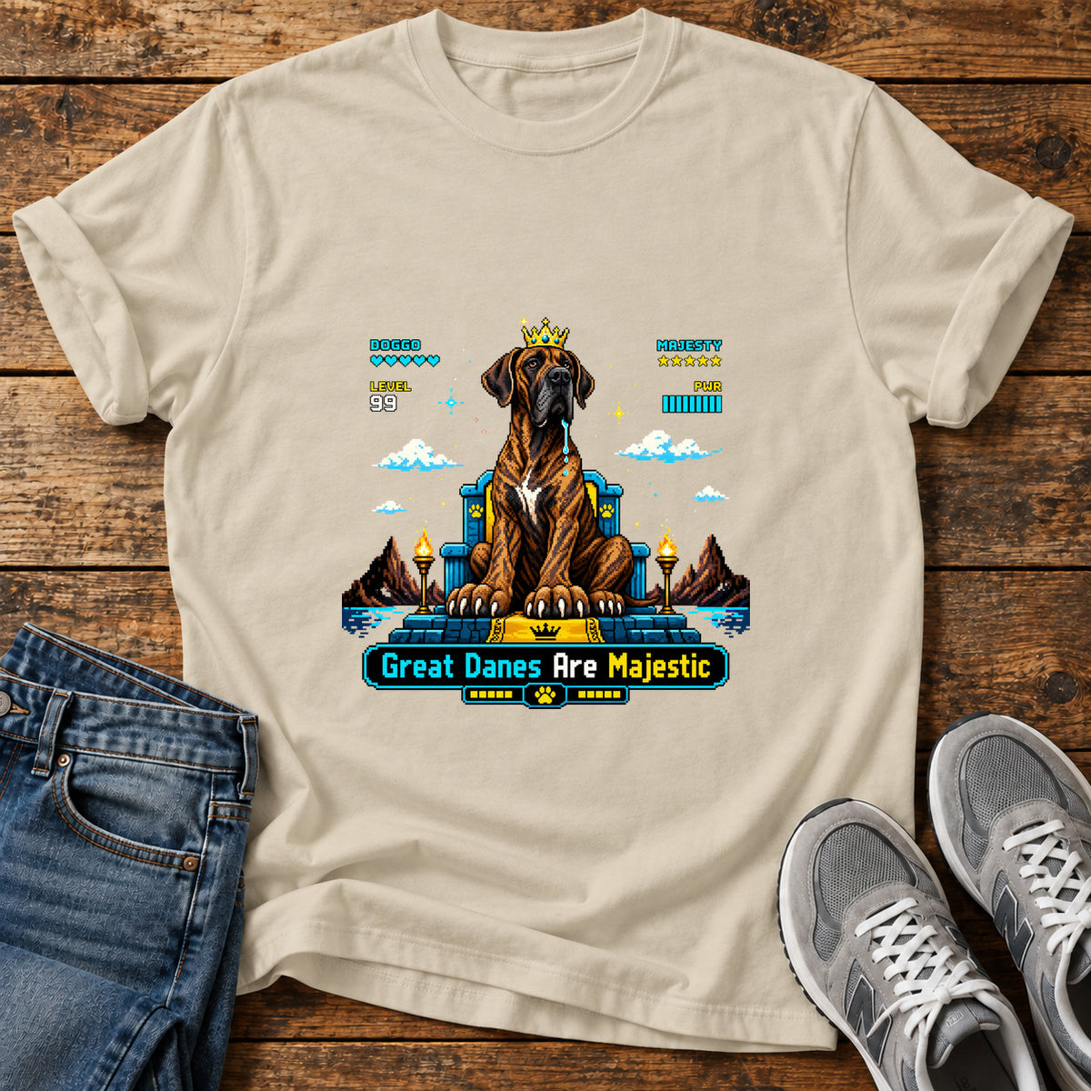 Great Danes Majestic graphic T-shirt in Sand, shown on a flat-lay shirt mockup